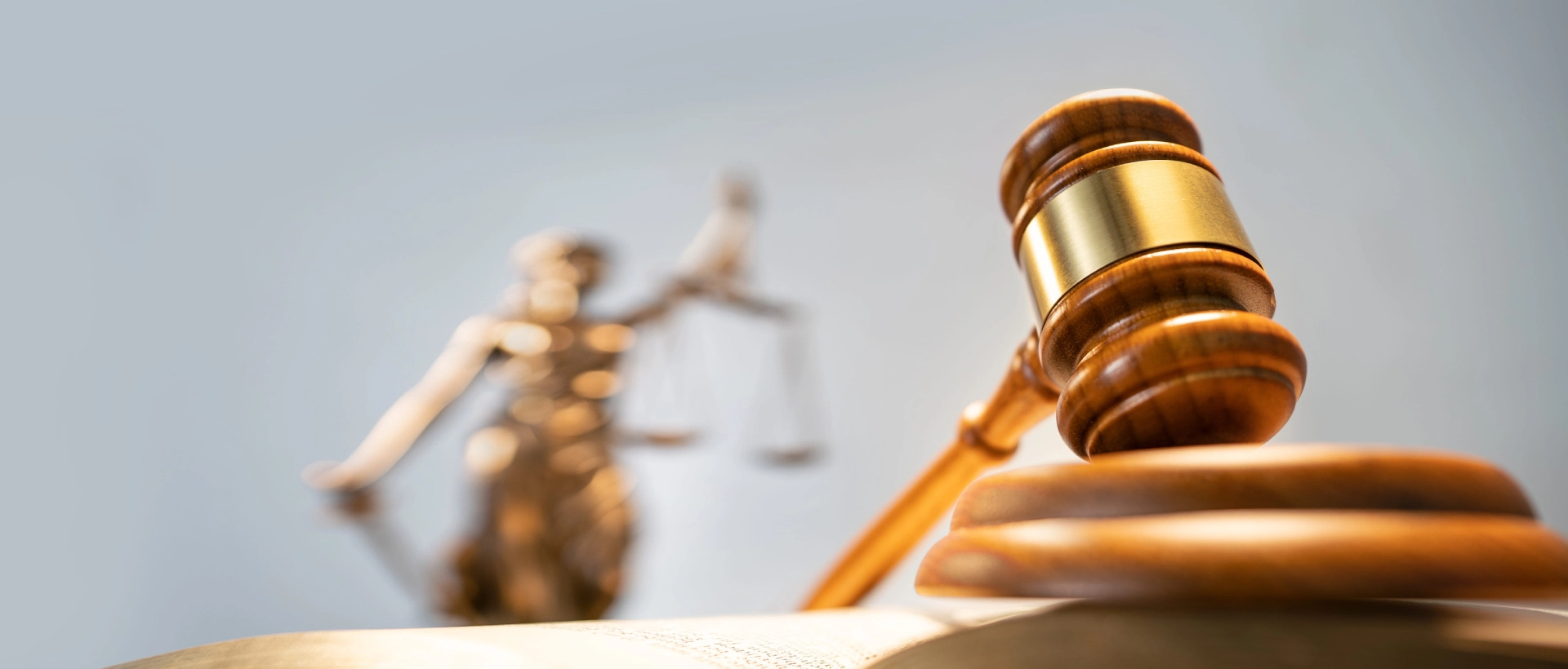 Statue of lady justice on bright background (1)