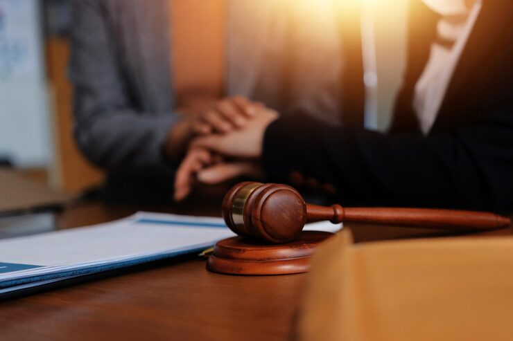judge-gavel-with-justice-lawyers-having-team-meeting-law-firm-background-concepts-law-legal-services