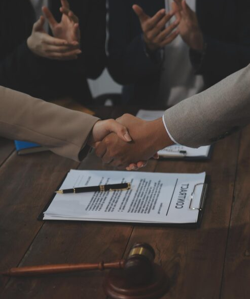judge-gavel-with-justice-lawyers-having-team-meeting-law-firm-background