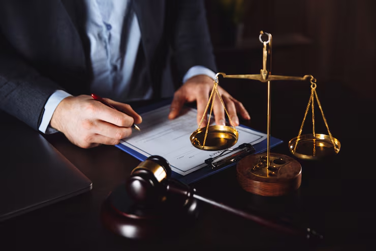 lawyer-office-statue-justice-with-scales-lawyer-working-laptop