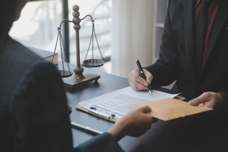 male-lawyer-working-with-contract-papers-wooden-gavel-tabel-courtroom-justice-law-attorney-court-judge-concept